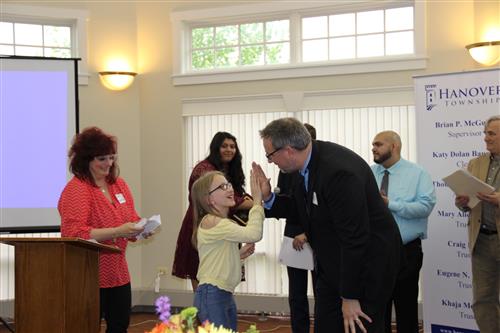 Student Julia Pachuta with Bartlett Elementary Principal John Signatur 